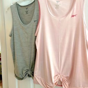 Two brand new Reebok tank tops with sweat bands.  Size Large.